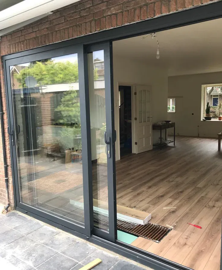 Technician servicing a sliding glass door