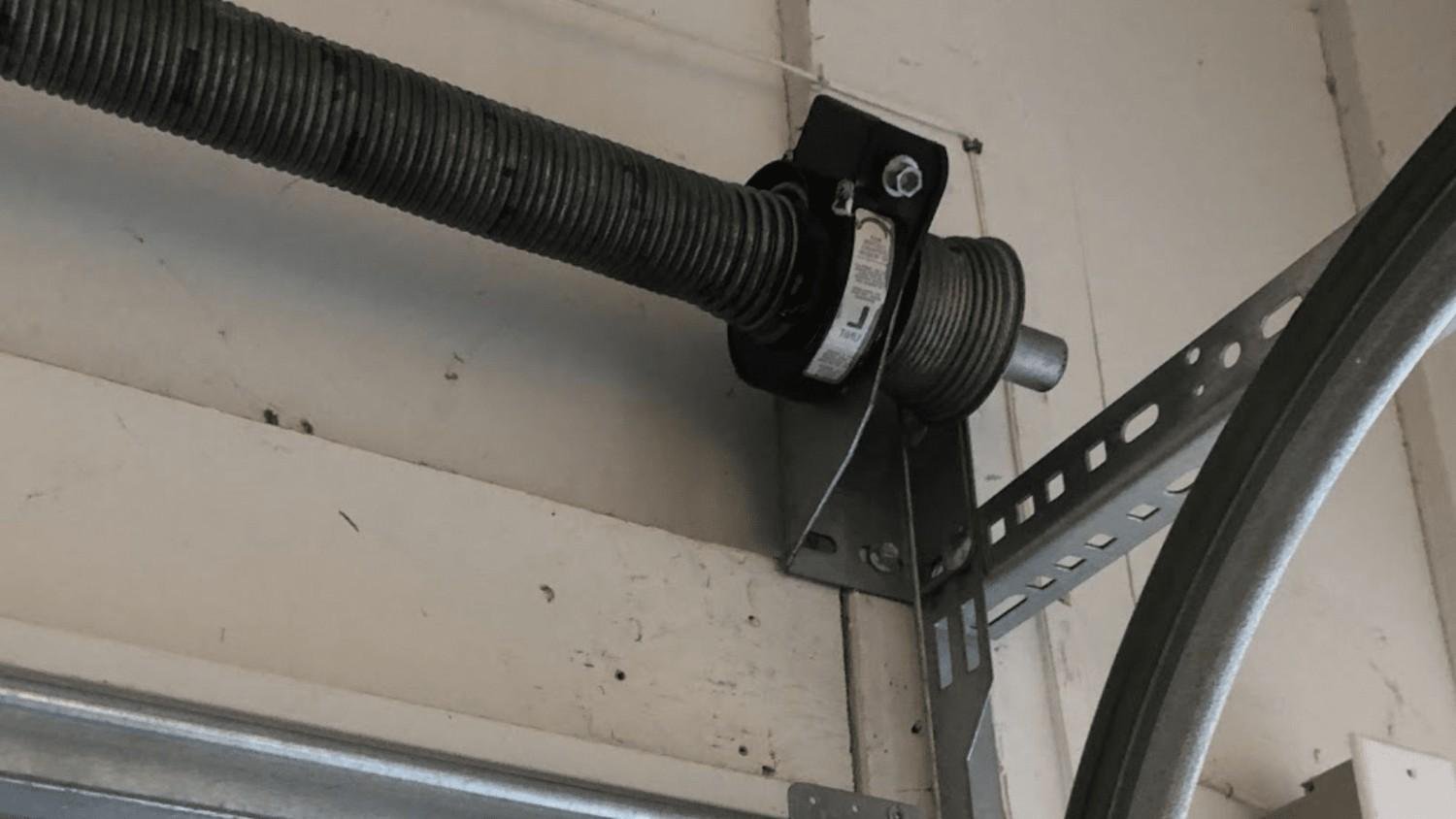 Garage door lift cable and drum assembly close up in Oxford, Ohio